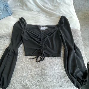 Black long sleeve crop top from Princess Polly